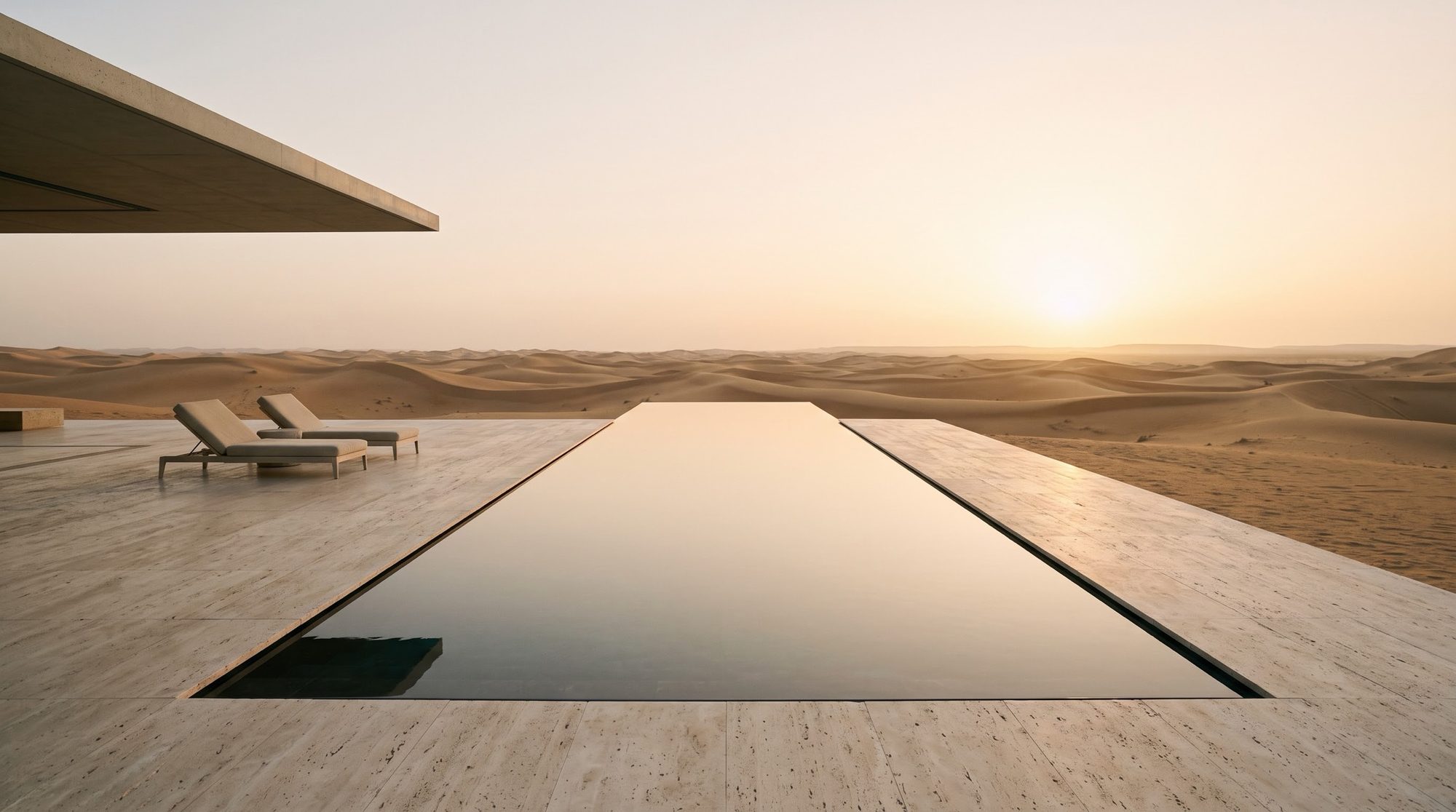 An infinity pool facing the dunes at sunset